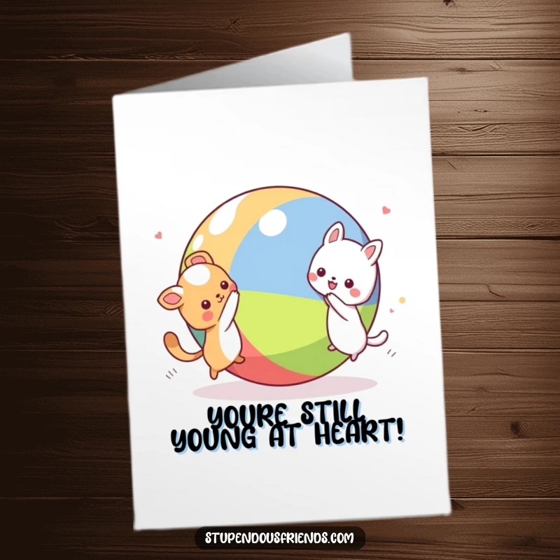 Funny Free Printable Birthday Card: Two Kawaii animals in a joyful chase around a giant, colorful ball, full of playful energy.